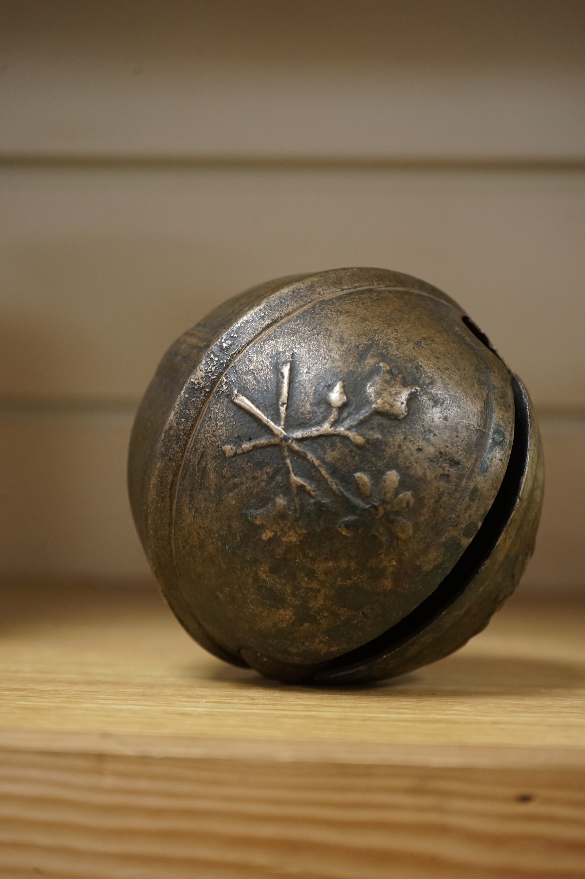 A 19th century livestock crotal bell engraved 8 1/2, 12cm wide